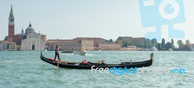 Gondolier In Venice Stock Photo