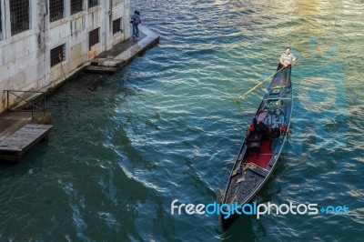 Gondolier Plying His Trade On The Grand Canal Venice Stock Photo