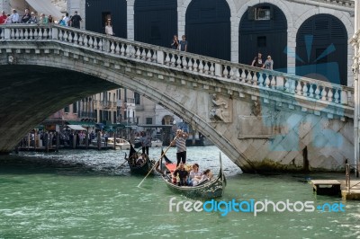 Gondoliers Ferrying People In Venice Stock Photo