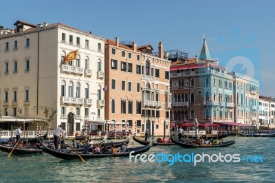 Gondoliers Ferrying People In Venice Stock Photo