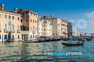 Gondoliers Ferrying People In Venice Stock Photo