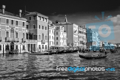 Gondoliers Ferrying People In Venice Stock Photo