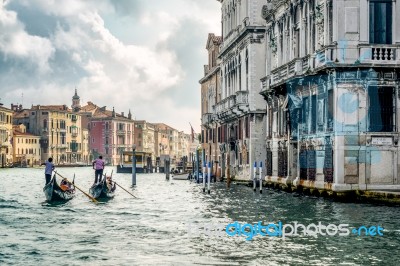 Gondoliers Ferrying People In Venice Stock Photo