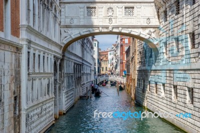 Gondoliers Ferrying People In Venice Stock Photo