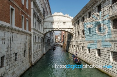 Gondoliers Ferrying People In Venice Stock Photo