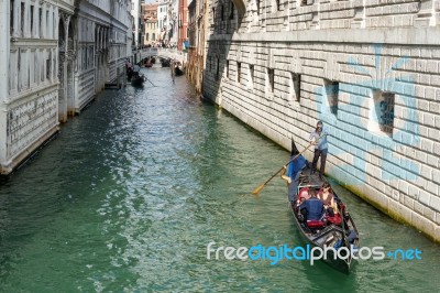 Gondoliers Ferrying People In Venice Stock Photo