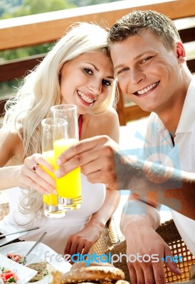 Good Morning - Couple Having Juice Smiling Stock Photo