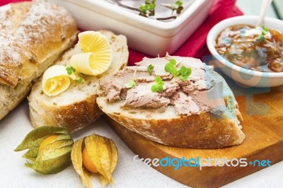 Goose Liver And Sauternes Pate With Chutney, Physalis, Sliced Br… Stock Photo