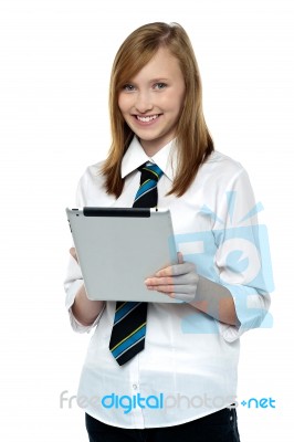 Gorgeous Teenager Browsing On Her Tablet Pc Stock Photo