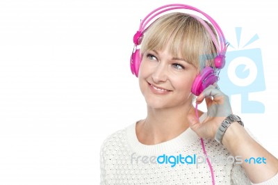 Gorgeous Woman Listening To Music Stock Photo