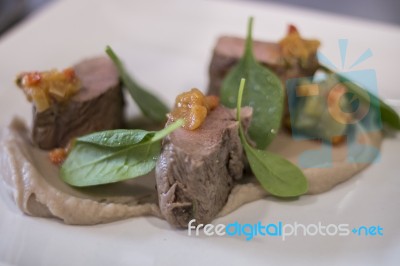 Gourmet Dish With Lamb And Spinach Stock Photo