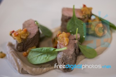 Gourmet Dish With Lamb And Spinach Stock Photo