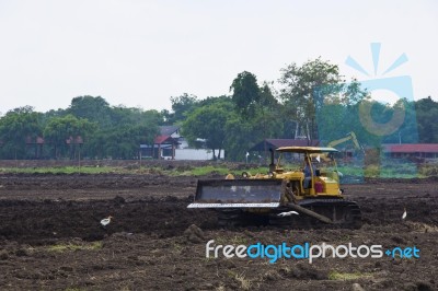 Grader Work On Dirty Ground Stock Photo