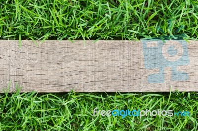 Grain Wood On Green Grass Stock Photo