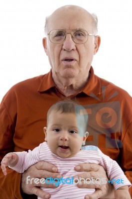 Grandpa Holding His Grandchild Stock Photo