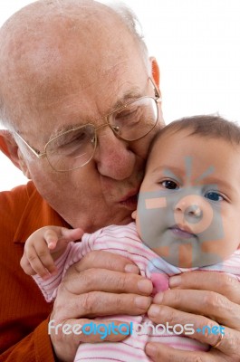 Grandpa Kissing his grandchild Stock Photo