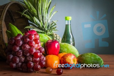 Grapes And Many Fruits On The Wood Stock Photo