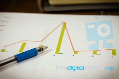 Graphs And Pen Stock Photo