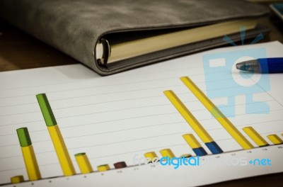 Graphs And Pen Stock Photo