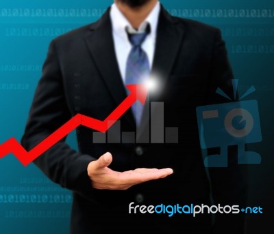 Graphs On The Hands Of Businessmen Stock Photo