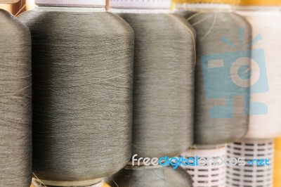 Gray Silk Thread In Spool Stock Photo