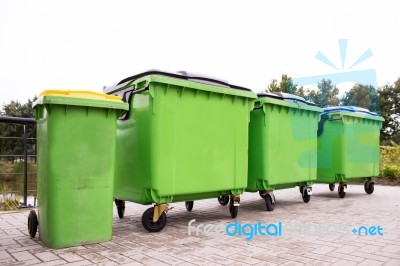 Greeen Garbage Containers In A Row Stock Photo