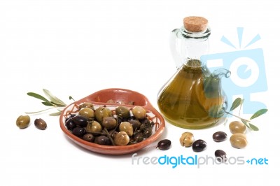 Green And Black Olives With Olive Oil Bottle Stock Photo