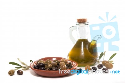 Green And Black Olives With Olive Oil Bottle Stock Photo