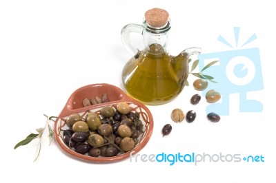 Green And Black Olives With Olive Oil Bottle Stock Photo