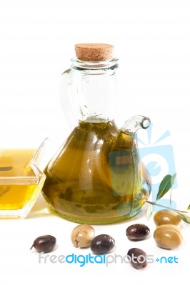 Green And Black Olives With Olive Oil Bottle Stock Photo