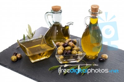 Green And Black Olives With Olive Oil Bottles Stock Photo