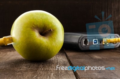 Green Apple Connected To A Data Network Stock Photo