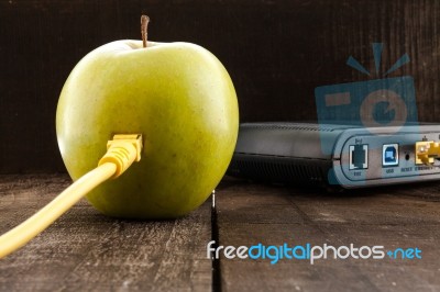 Green Apple Connected To A Data Network Stock Photo