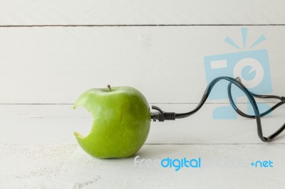 Green Apple Connected To An Ethernet Cable Stock Photo