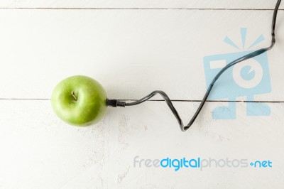 Green Apple Connected To An Ethernet Cable Stock Photo