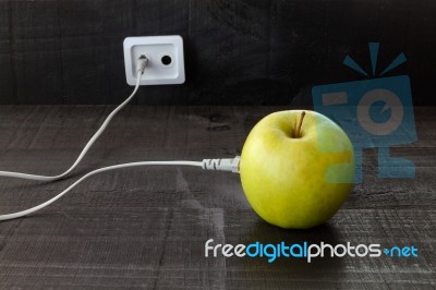 Green Apple Connected To An Ethernet Cable Stock Photo