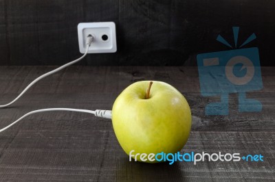 Green Apple Connected To An Ethernet Cable Stock Photo