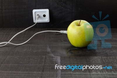 Green Apple Connected To An Ethernet Cable Stock Photo