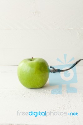 Green Apple Connected To An Ethernet Cable Stock Photo