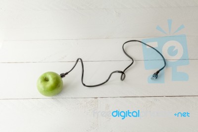 Green Apple Connected To An Ethernet Cable Stock Photo