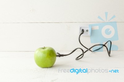 Green Apple Connected To An Ethernet Cable Stock Photo