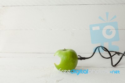 Green Apple Connected To An Ethernet Cable Stock Photo