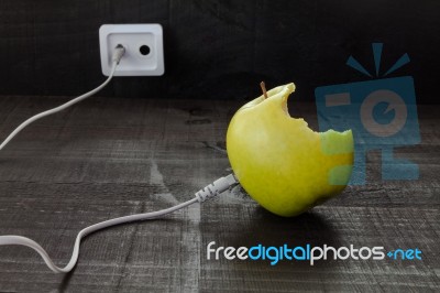 Green Apple Connected To An Ethernet Cable Stock Photo