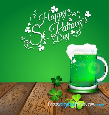 Green Beer With Shamrock On Wooden Floor For St. Patrick's Day Stock Image