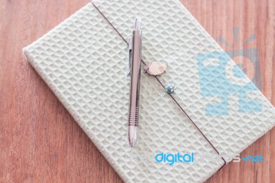 Green Cover Notebook With Pen Stock Photo