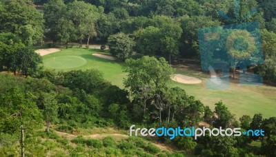 Green Field Golf Club In Tropical Forest Stock Photo