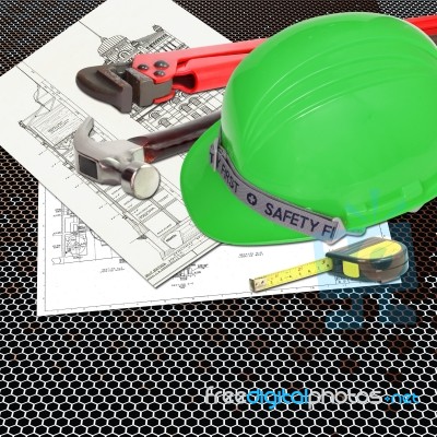 Green Hard Hat On Blueprint Stock Photo