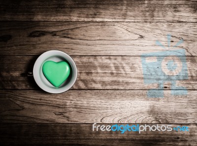 Green Heart Ceramic In Coffee Cup Stock Photo