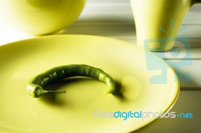 Green Hot Pepper On Dish Stock Photo