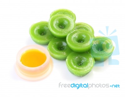 Green Multiple Scented Chinese Sweet And Liquid Sugar On White Floor Stock Photo